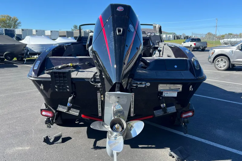 Slide: The Image of 2026 Vexus DVX20S boat with powerful outboard motor in a parking lot. - 4