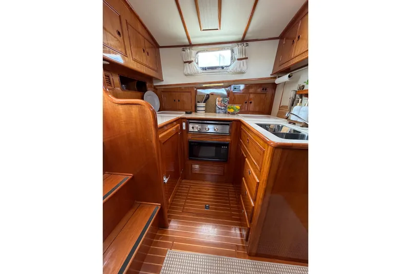 Slide: The Image of Luxurious wooden interior of 1999 Grand Banks 38 Eastbay HX yacht kitchen. - 37