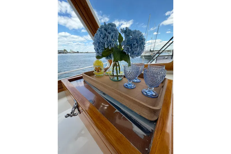 Slide: The Image of Elegant table setting with blue hydrangeas on a 1999 Grand Banks 38 Eastbay HX yacht. - 43