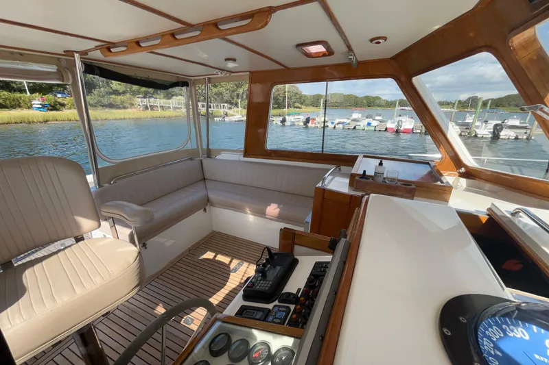 Slide: The Image of Interior of a 1999 Eastbay 38 boat with seating and navigation equipment. - 7