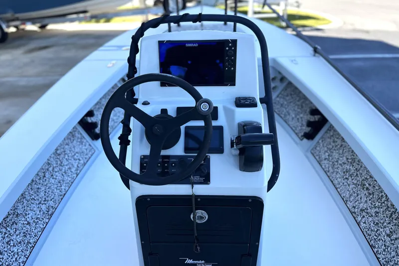 Slide: The Image of 2021 Maverick 18 HPX-V boat console with steering wheel and navigation system. - 10