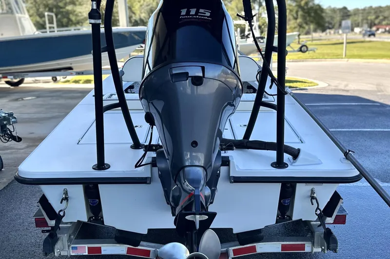 Slide: The Image of 2021 Maverick 18 HPX-V boat with 115 HP engine on trailer, rear view. - 14