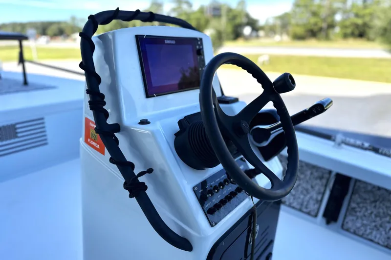 Slide: The Image of 2021 Maverick 18 HPX-V boat console with steering wheel and navigation system. - 3