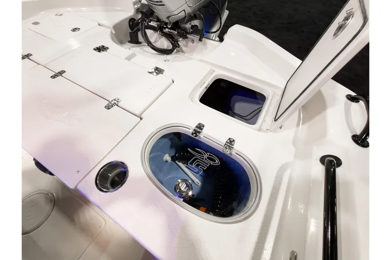 Slide: The Image of 2026 Sea Chaser 23 LX boat interior with storage compartments and livewell. - 11
