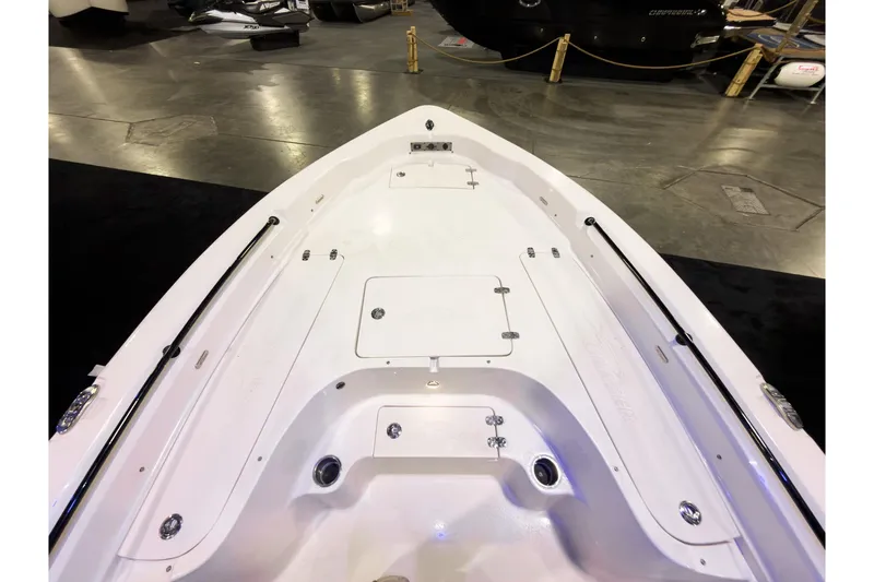 Slide: The Image of 2026 Sea Chaser 23 LX boat interior, showcasing sleek white deck design. - 17