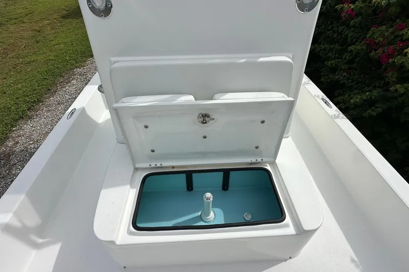 Slide: The Image of 2020 Shallow Sport 24 Classic boat with open storage compartment on deck. - 15