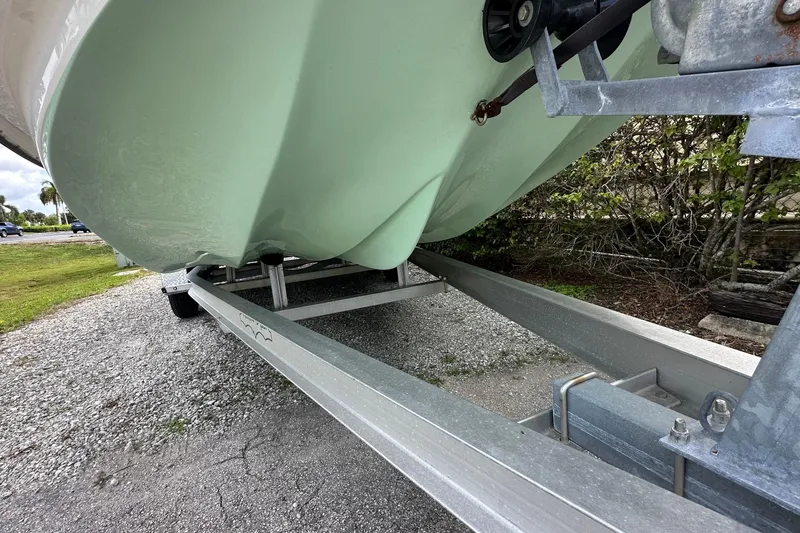Slide: The Image of 2020 Shallow Sport 24 Classic boat on trailer, close-up view of hull and trailer. - 18