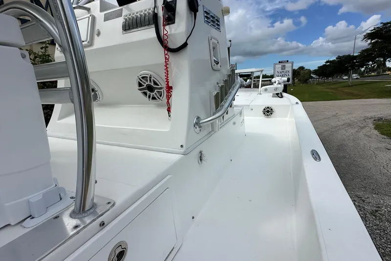 Slide: The Image of 2020 Shallow Sport 24 Classic boat at Naples Marina, featuring sleek white design and modern controls. - 9