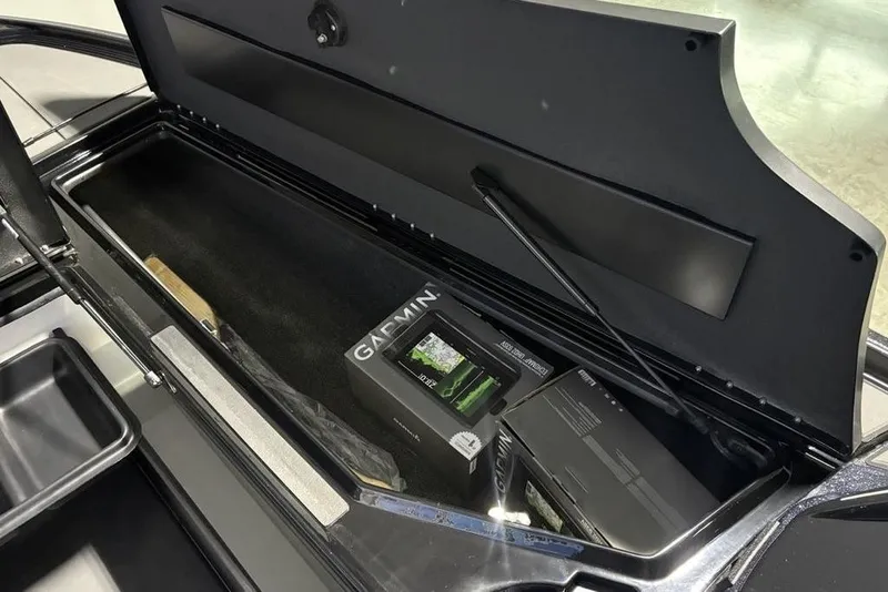 Slide: The Image of Open storage compartment in 2026 Nitro Z20 XL Pro boat with Garmin electronics. - 13