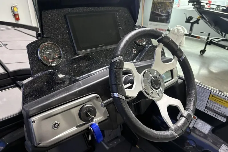 Slide: The Image of 2026 Nitro Z20 XL Pro boat dashboard with steering wheel and digital display. - 17
