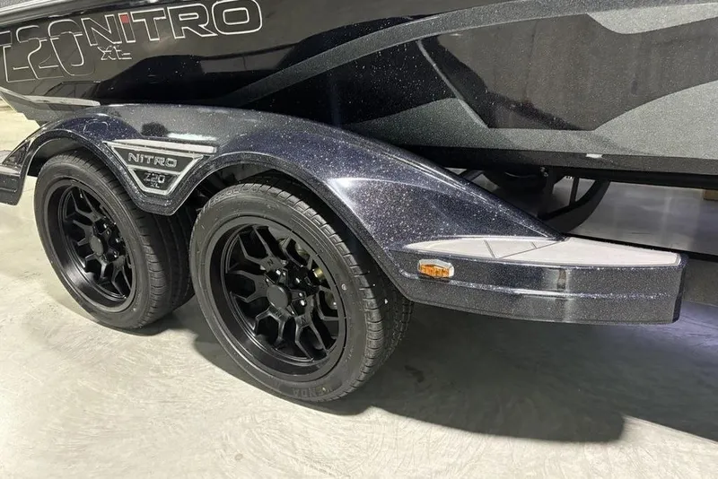 Slide: The Image of 2026 Nitro Z20 XL Pro boat trailer with black wheels and sleek design. - 9