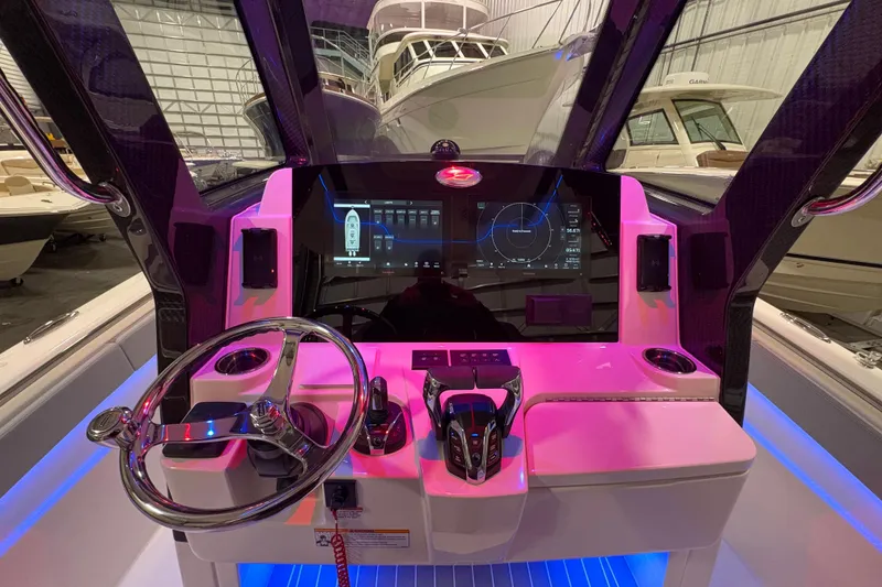 Slide: The Image of 2026 Scout 288 LXF boat dashboard with advanced navigation display and controls. - 14