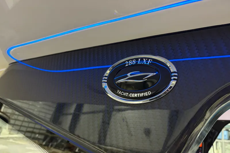 Slide: The Image of 2026 Scout 288 LXF yacht certified emblem with sleek carbon fiber design. - 15