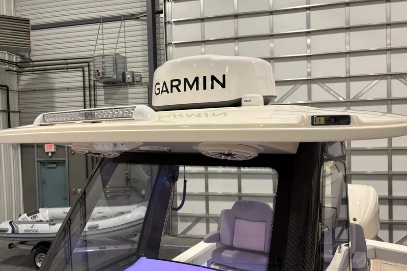 Slide: The Image of 2026 Scout 288 LXF boat with Garmin radar and advanced navigation equipment. - 17