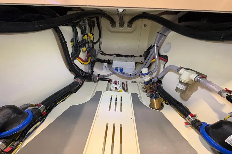 Slide: The Image of Engine compartment of 2026 Scout 288 LXF boat, showcasing wiring and components. - 26