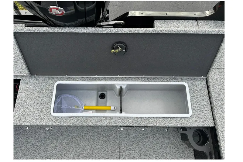 Slide: The Image of 2026 Lund 1800 Explorer SS boat storage compartment with net and yellow handle. - 13