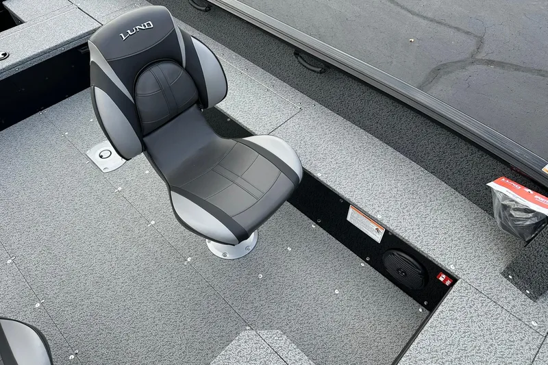 Slide: The Image of 2026 Lund 1800 Explorer SS boat interior with a sleek, modern seat design. - 23