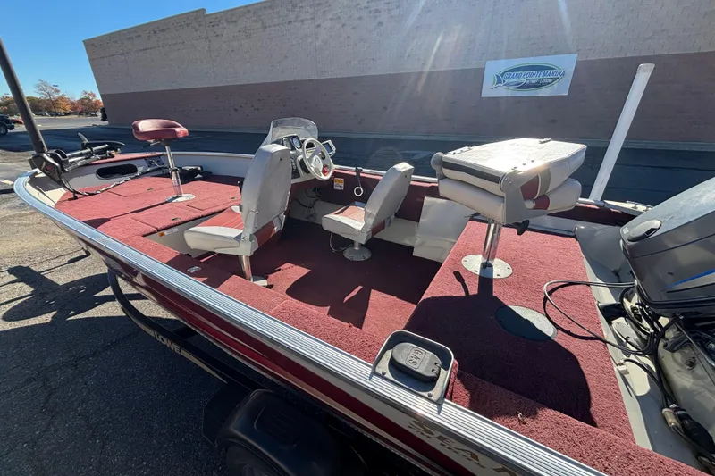 Slide: The Image of 2002 Sea Nymph FM 165 S fishing boat with red interior and swivel seats. - 11