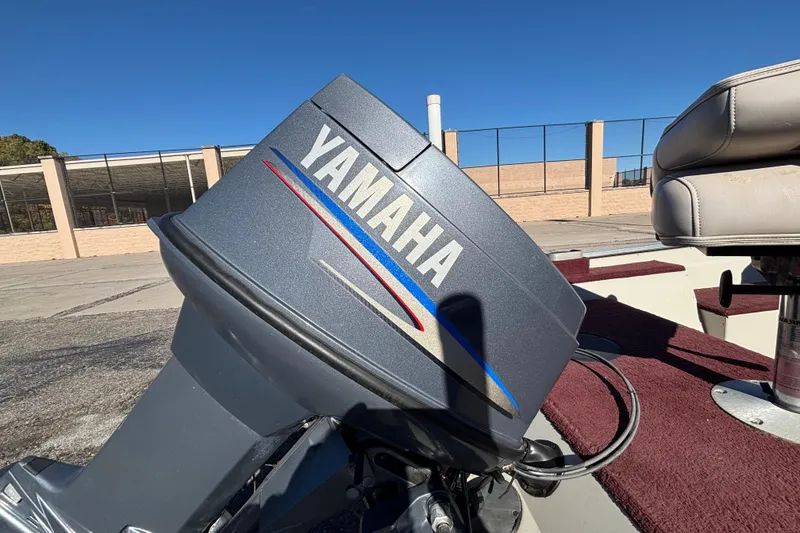 Slide: The Image of Yamaha outboard motor on 2002 Sea Nymph FM 165 S boat, sunny day background. - 4