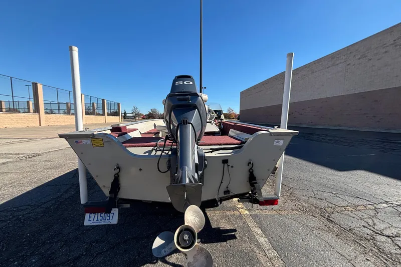 Slide: The Image of 2002 Sea Nymph FM 165 S boat with outboard motor in parking lot. - 5
