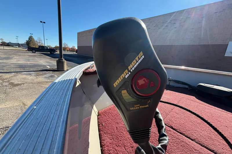 Slide: The Image of Minn Kota motor on 2002 Sea Nymph FM 165 S boat, parked in a lot. - 7