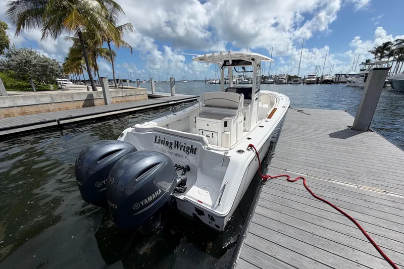 Slide: The Image of 2022 Sea Hunt Ultra 275 SE boat docked with twin Yamaha engines, Coconut Grove marina. - 36