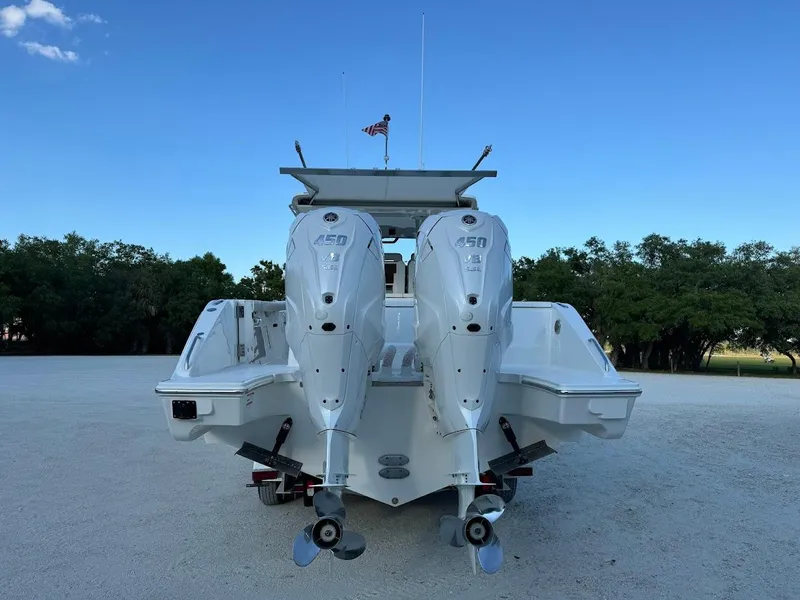 Slide: The Image of 2024 Pursuit S 358 Sport boat with dual outboard engines, rear view. - 10