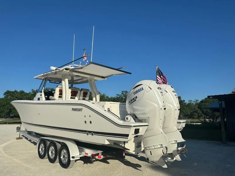 Slide: The Image of 2024 Pursuit S 358 Sport boat with dual Yamaha engines on a trailer. - 15