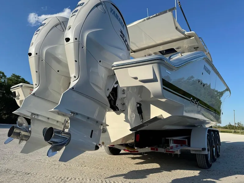 Slide: The Image of 2024 Pursuit S 358 Sport boat with dual outboard engines on a trailer. - 22