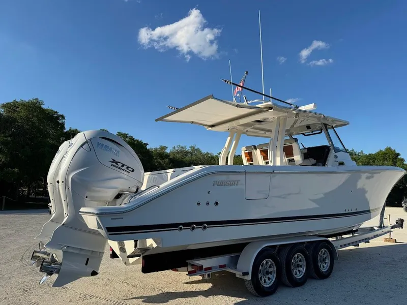 Slide: The Image of 2024 Pursuit S 358 Sport boat on trailer under clear blue sky. - 3