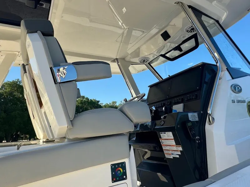 Slide: The Image of 2024 Pursuit S 358 Sport boat interior with modern helm and seating. - 31