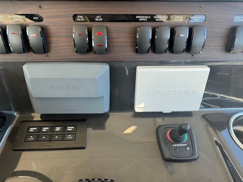 Slide: The Image of Control panel of 2024 Pursuit S 358 Sport boat with JL Audio and Seakeeper systems. - 43