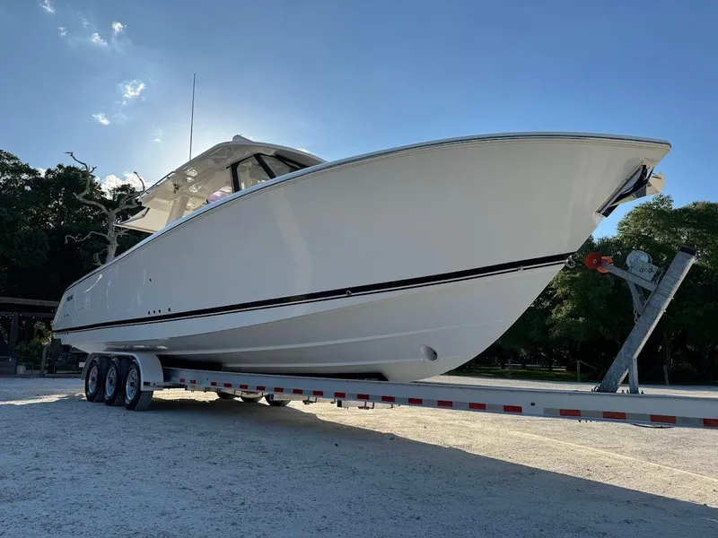 Slide: The Image of 2024 Pursuit S 358 Sport boat on trailer, side view, sunny day. - 6