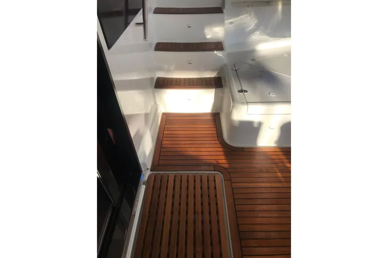 Slide: The Image of Teak deck and steps on 2014 FONTAINE PAJOT 63 yacht, showcasing elegant marine design. - 12