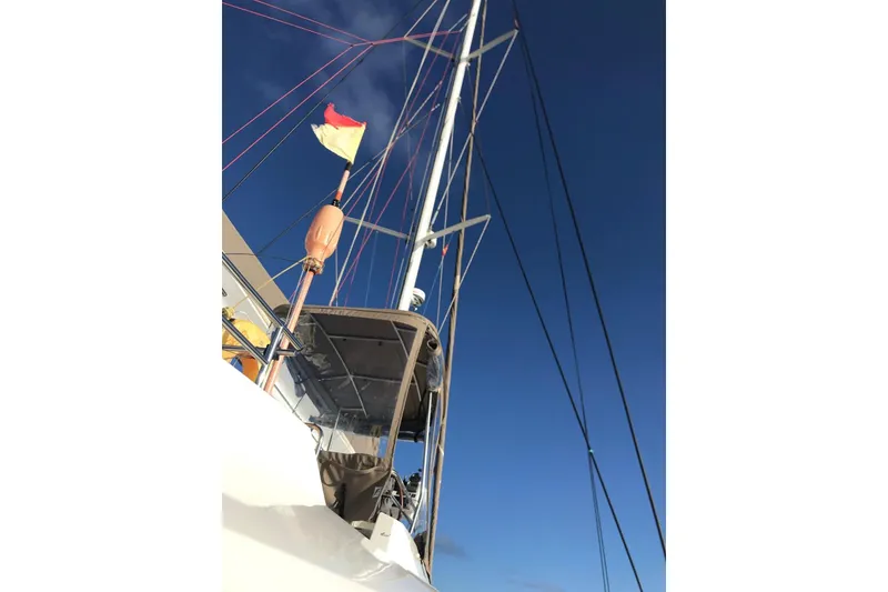 Slide: The Image of Sailboat mast and rigging of 2014 FONTAINE PAJOT 63 against clear blue sky. - 23