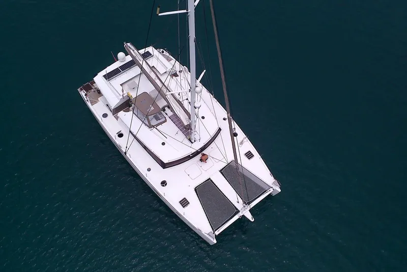 Slide: The Image of Aerial view of 2014 FONTAINE PAJOT 63 catamaran sailing on calm waters. - 3