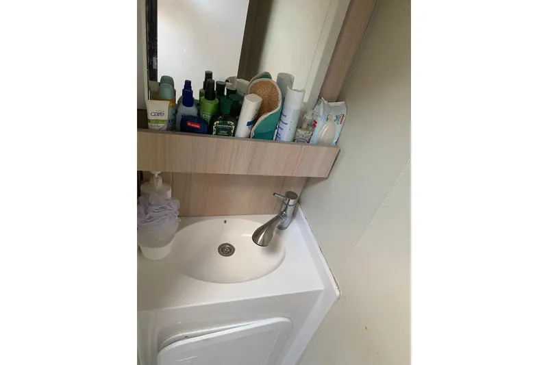 Slide: The Image of Bathroom sink area with toiletries on a 2014 FONTAINE PAJOT 63 yacht. - 40