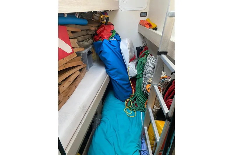 Slide: The Image of Storage area on 2014 FONTAINE PAJOT 63 yacht with ropes, ladder, and equipment. - 42