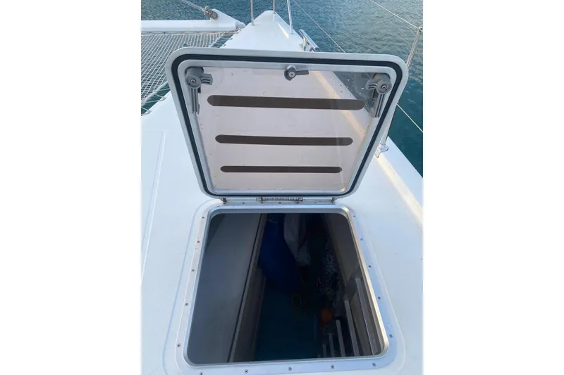 Slide: The Image of Open hatch on 2014 FONTAINE PAJOT 63 yacht deck, overlooking the sea. - 43