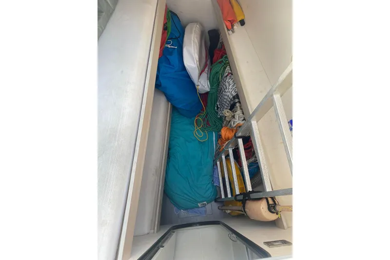 Slide: The Image of Storage compartment on a 2014 FONTAINE PAJOT 63 yacht, filled with ropes and equipment. - 45
