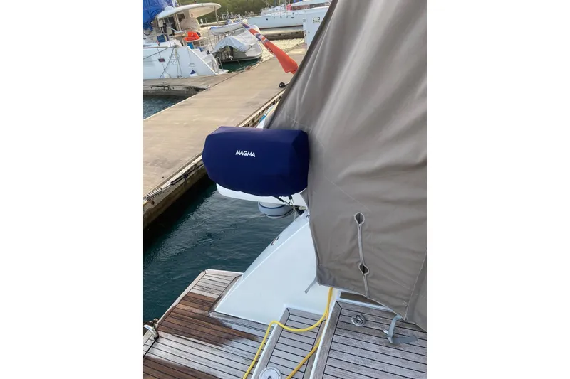 Slide: The Image of Docked 2014 FONTAINE PAJOT 63 yacht with covered equipment, featuring a Magma grill. - 50