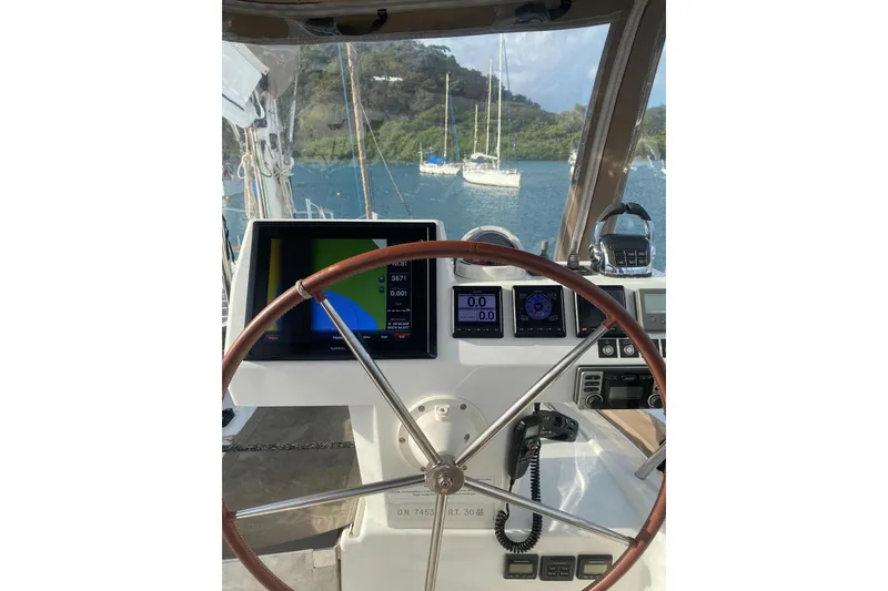 Slide: The Image of Helm of 2014 FONTAINE PAJOT 63 yacht with navigation screens and steering wheel. - 51