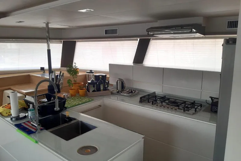 Slide: The Image of Modern kitchen interior on 2014 FONTAINE PAJOT 63 yacht with sleek design and appliances. - 9