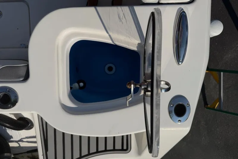 Slide: The Image of 2019 Tidewater 232 CC Adventure boat helm with steering wheel and control panel. - 15