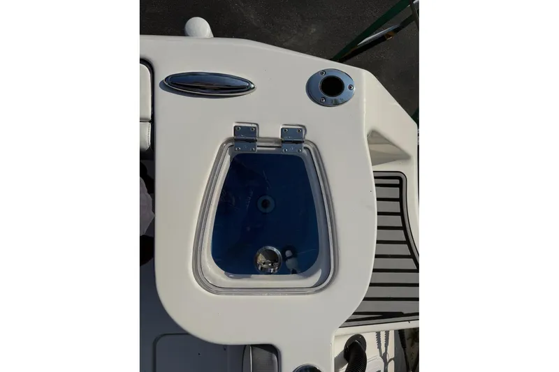 Slide: The Image of 2019 Tidewater 232 CC Adventure boat deck with hatch and fittings. - 16
