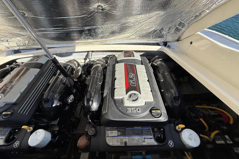 Slide: The Image of 2018 Chris-Craft Launch 30 engine compartment with dual 6.2L Mercury engines. - 10