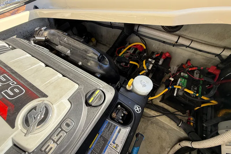 Slide: The Image of Engine compartment of a 2018 Chris-Craft Launch 30, featuring a 350 HP engine and battery setup. - 11