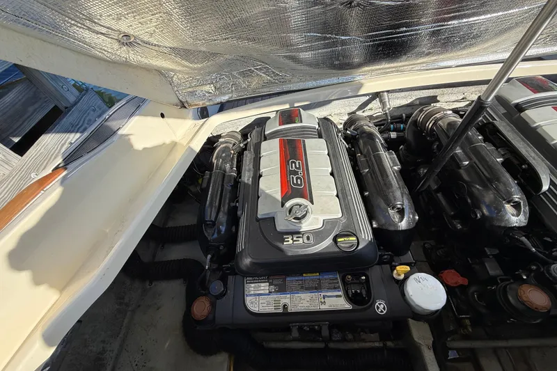 Slide: The Image of Engine compartment of a 2018 Chris-Craft Launch 30 boat, featuring a 6.2L engine. - 14