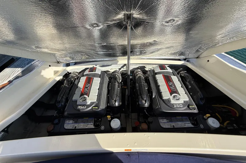 Slide: The Image of 2018 Chris-Craft Launch 30 engine compartment with dual 6.2L 350 horsepower engines. - 15