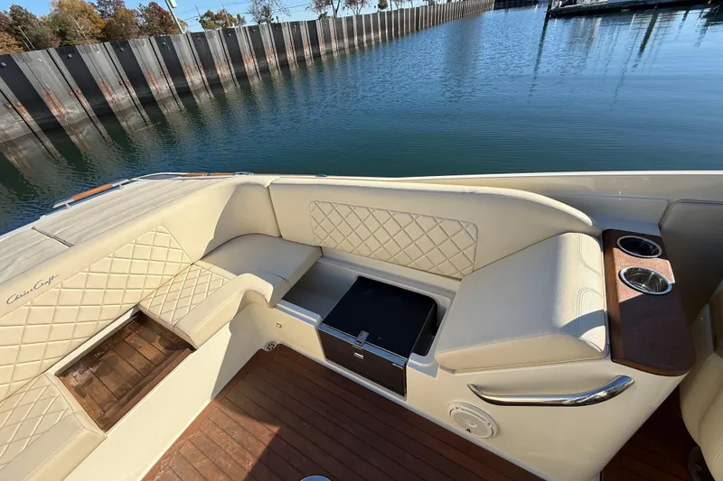 Slide: The Image of 2018 Chris-Craft Launch 30 boat interior with beige seating and wooden accents. - 21